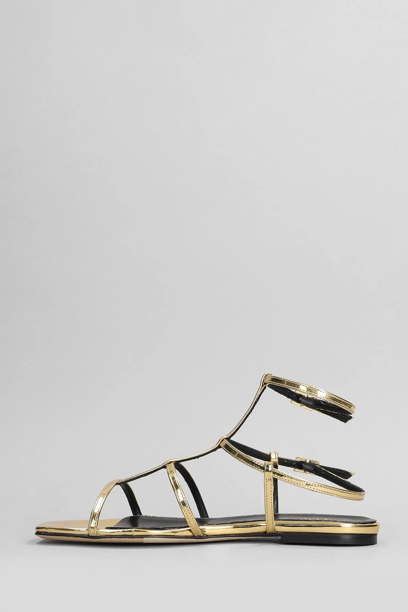 Flats in gold leather