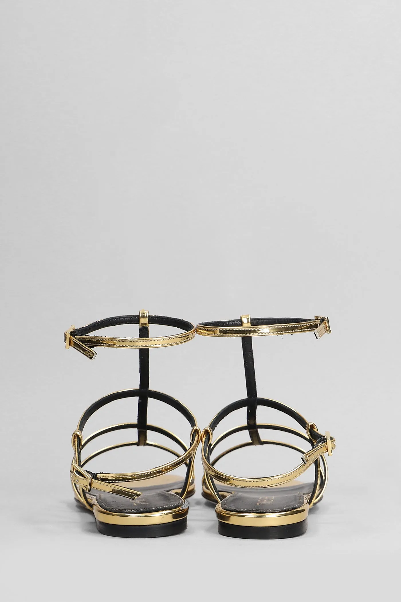 Flats in gold leather