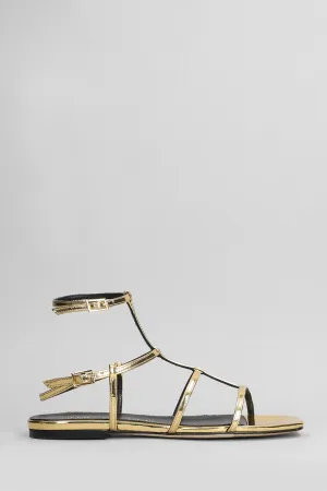 Flats in gold leather