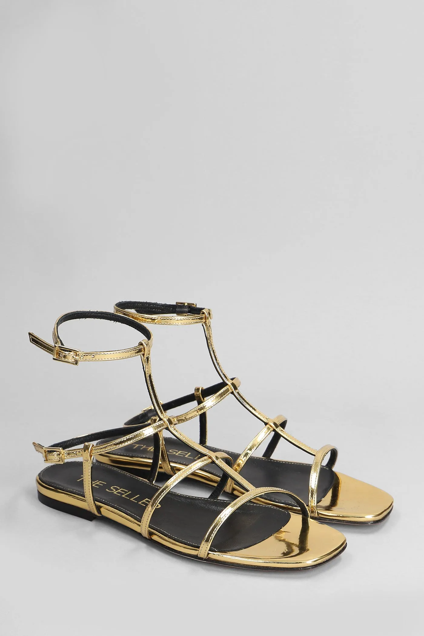 Flats in gold leather